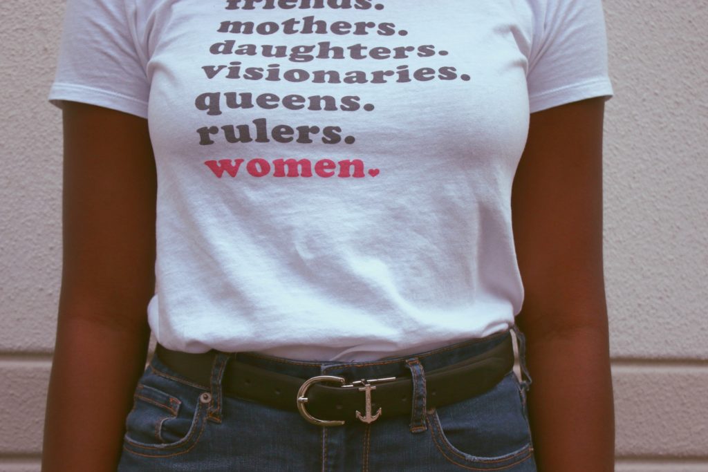 Woman wearing a tshirt with female roles 
